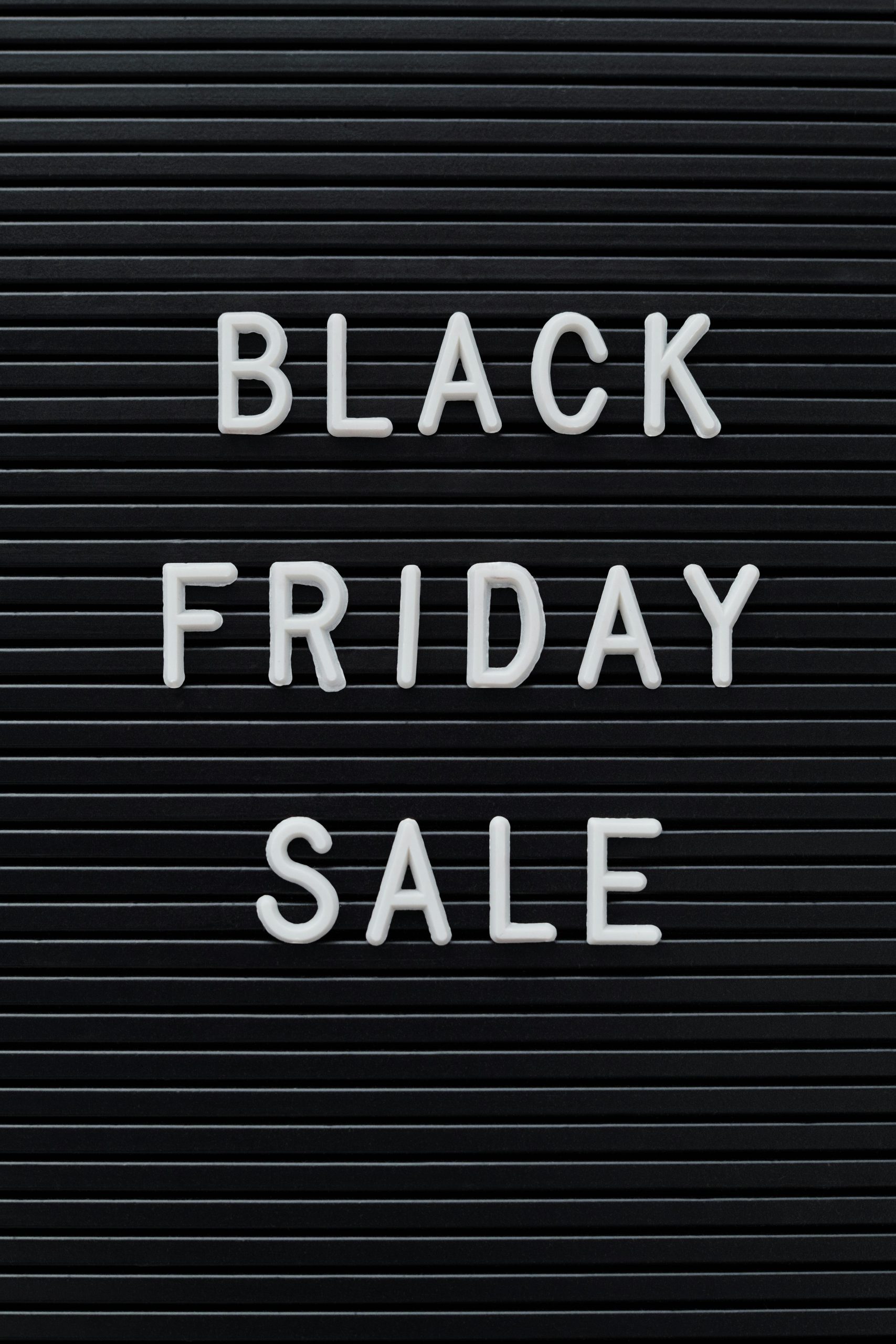 Simple black sign with 'Black Friday Sale' text, perfect for consumerism and discount themes.